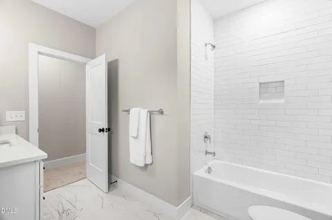 a picture of a bench in front of a white house