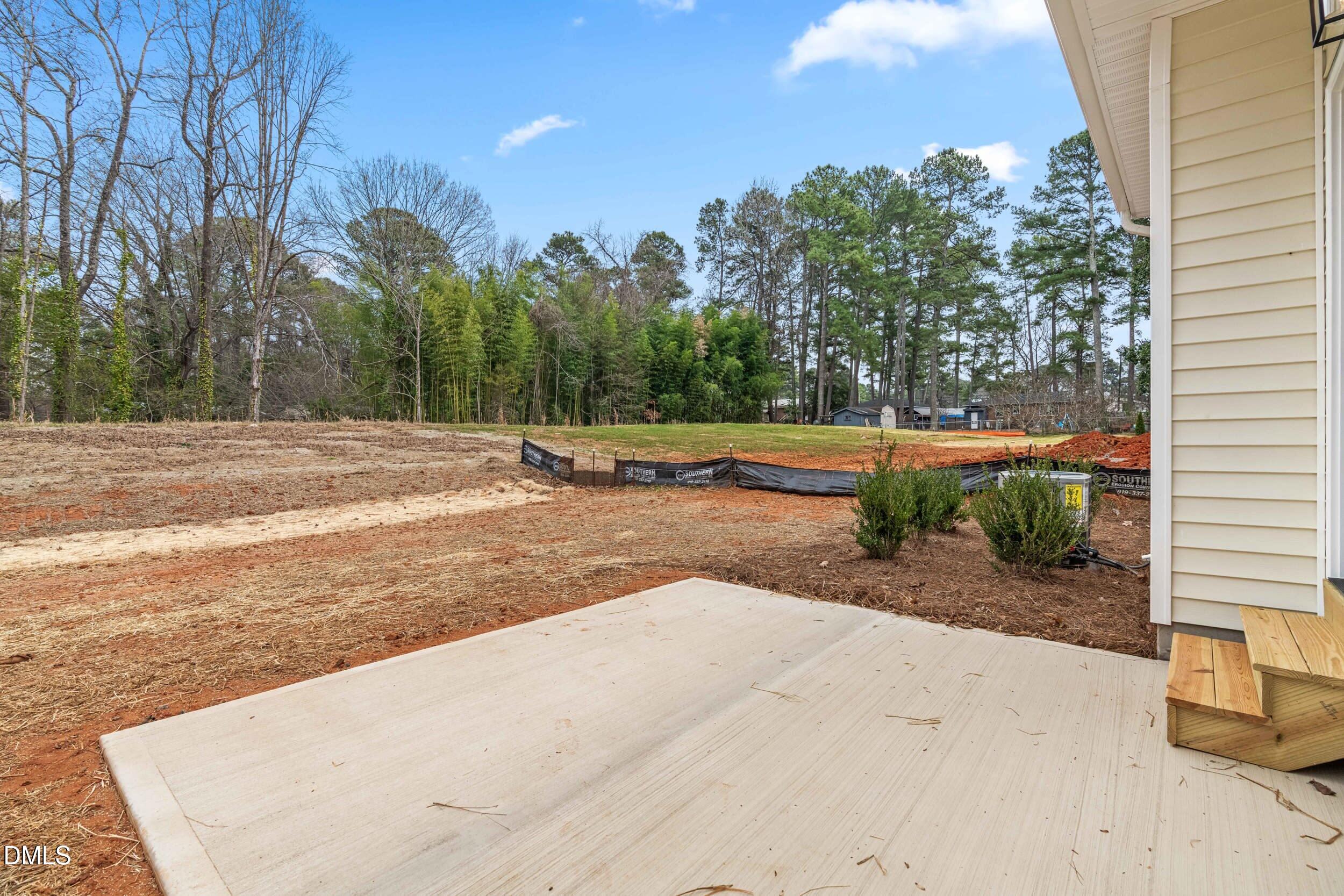 1020 Harper Road Raleigh, NC 27603 - Photo 30 of 52 a view of a yard with palm trees