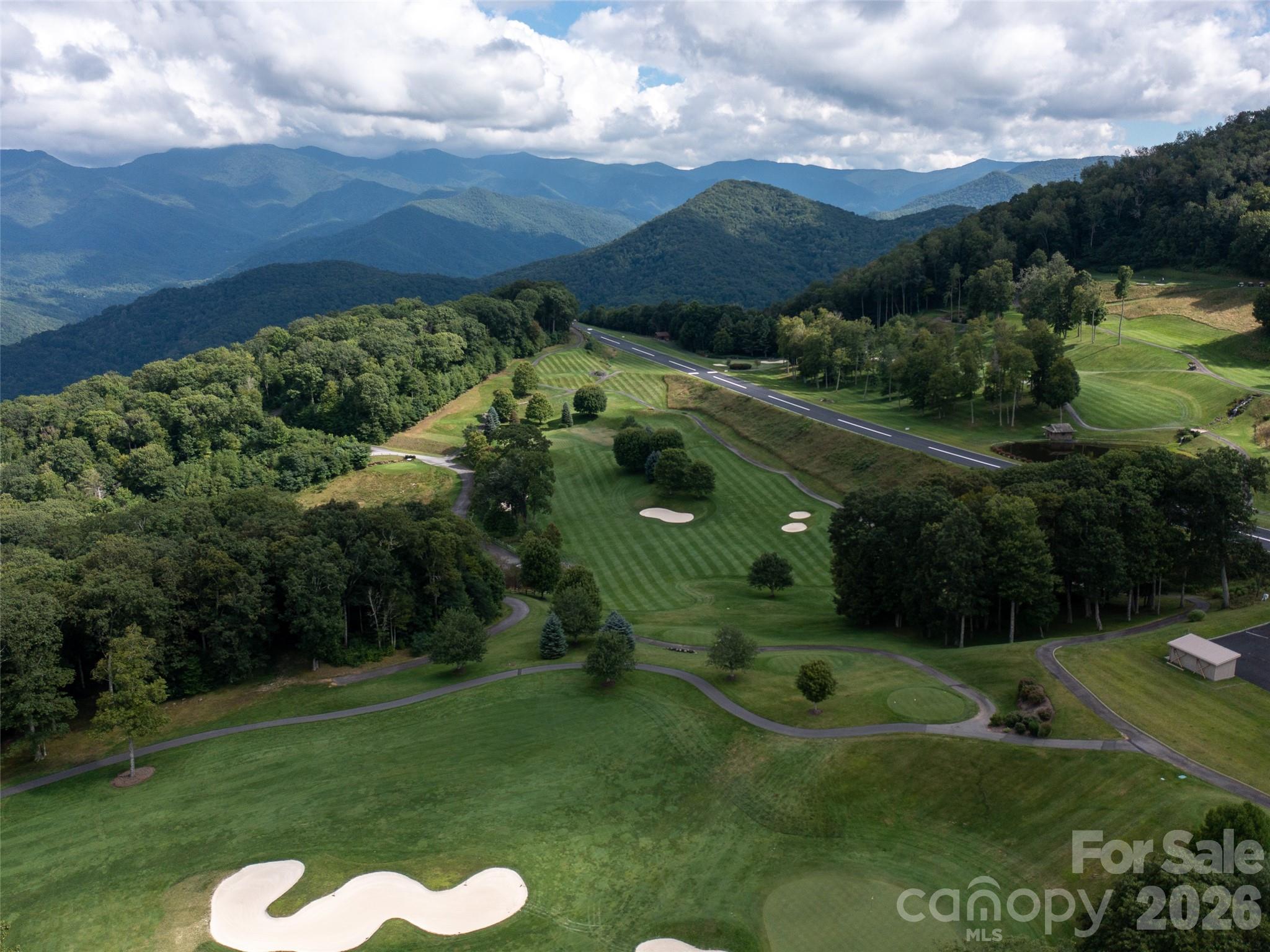 Lot 4 Heritage Ridge Road Burnsville, NC 28714 - Photo 20 of 28 a view of a lake with a yard