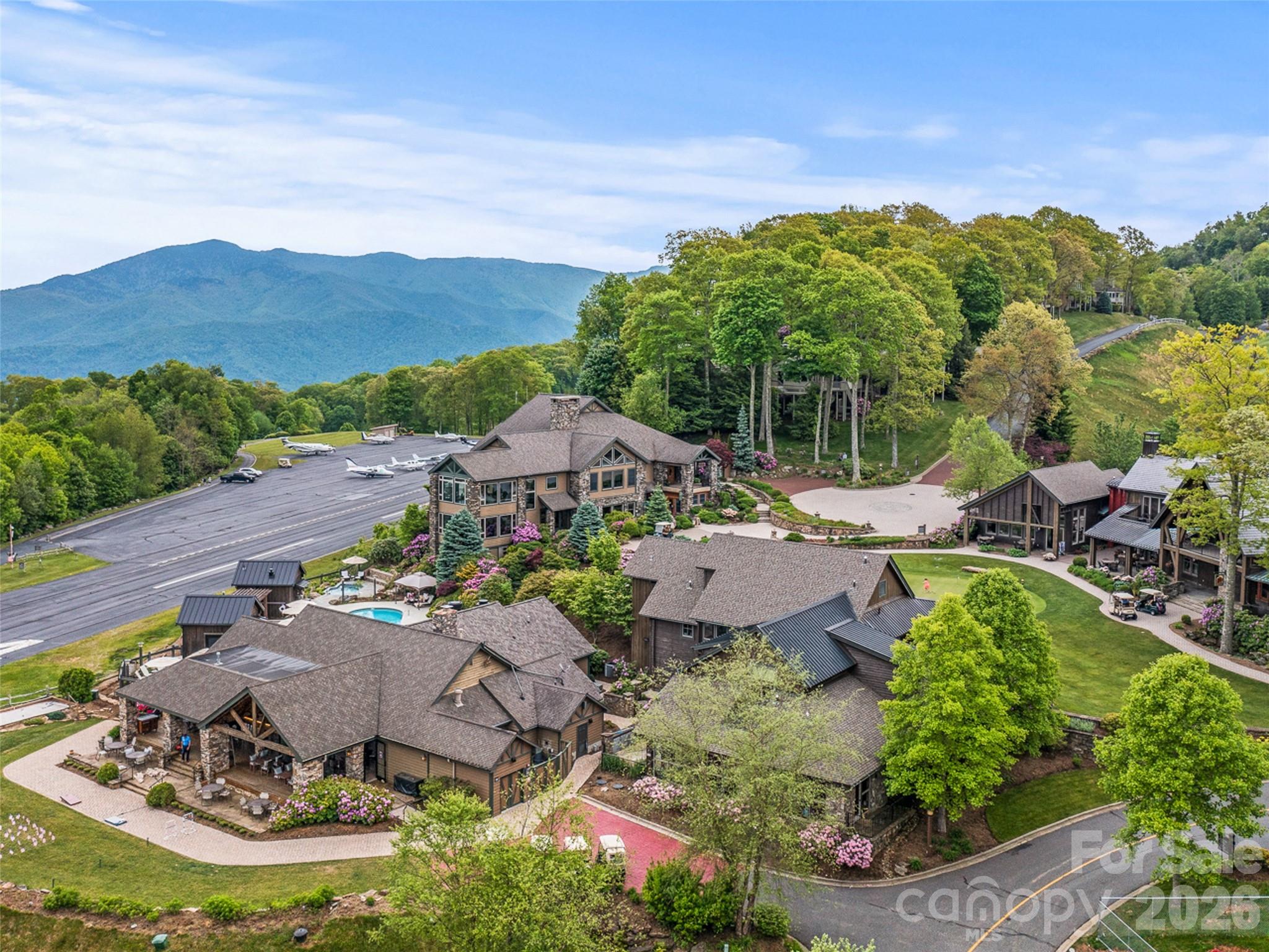 Lot 4 Heritage Ridge Road Burnsville, NC 28714 - Photo 22 of 28 a view of a patio with table and chairs and potted plants