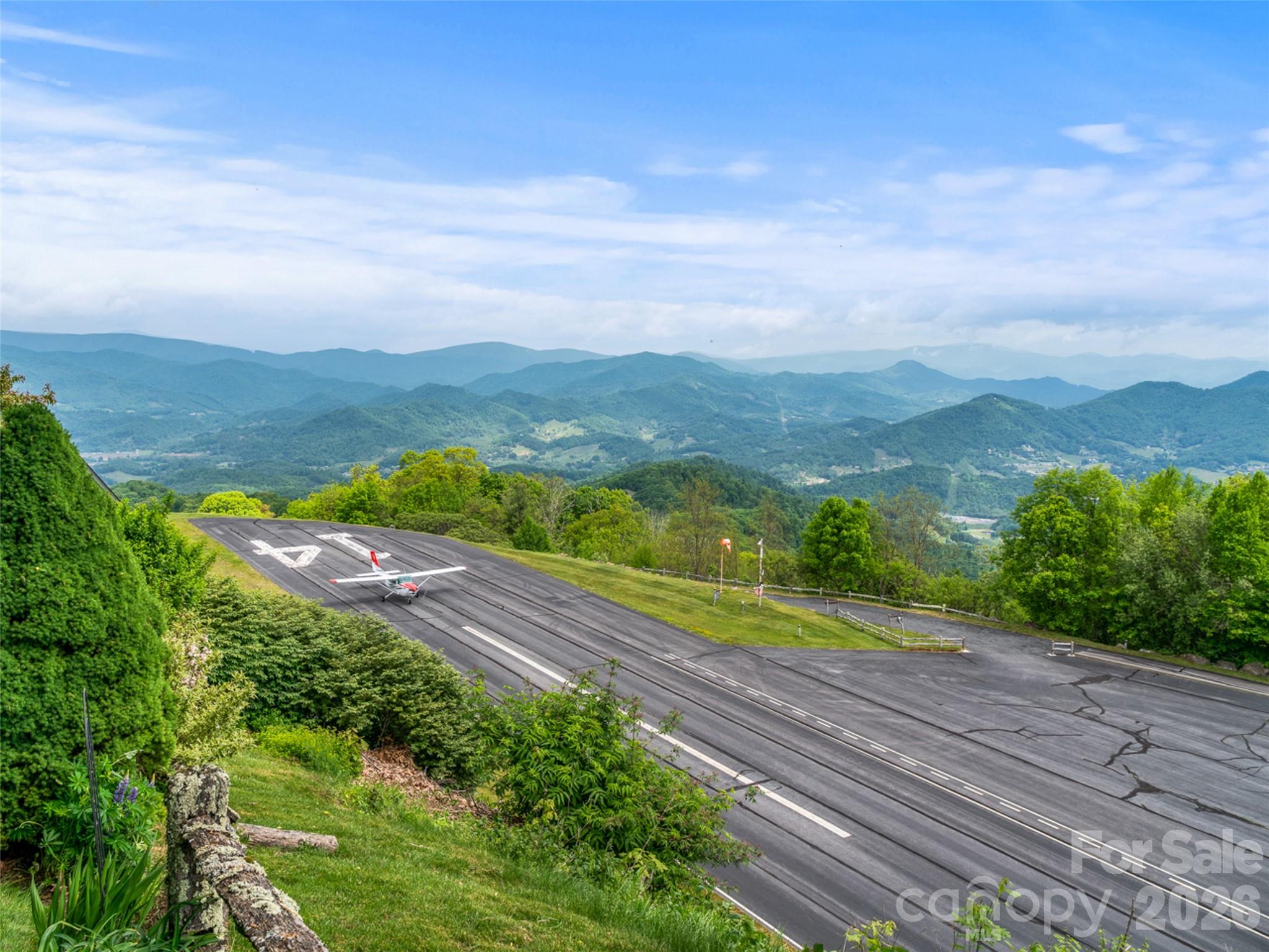 Lot 4 Heritage Ridge Road Burnsville, NC 28714 - Photo 25 of 28 a view of a city with lush green forest