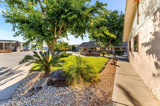a view of a backyard with a patio