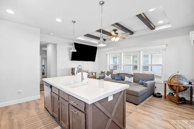 a view of living room kitchen with furniture and a flat screen tv