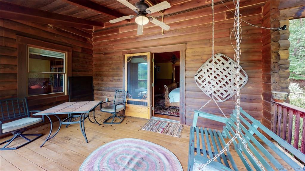1823 Barnard Road Marshall, NC 28753 - Photo 13 of 48 a view of a dinning tables and chairs in patio