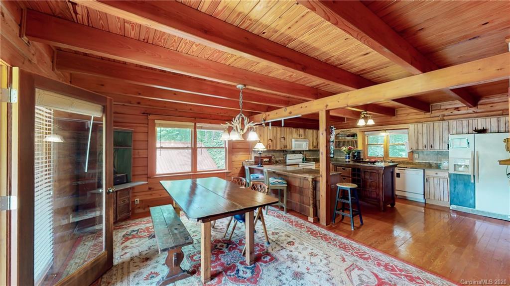 1823 Barnard Road Marshall, NC 28753 - Photo 18 of 48 a dining room with furniture and wooden floor
