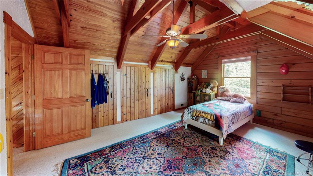 1823 Barnard Road Marshall, NC 28753 - Photo 27 of 48 a bed room with a bed and a window