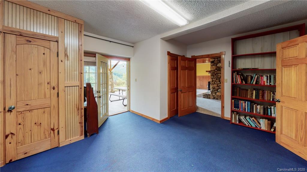 1823 Barnard Road Marshall, NC 28753 - Photo 38 of 48 an empty room with wooden floor and closet