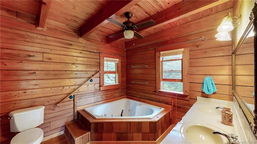 1823 Barnard Road Marshall, NC 28753 - Photo 9 of 48 a view of a bathtub and an outdoor space