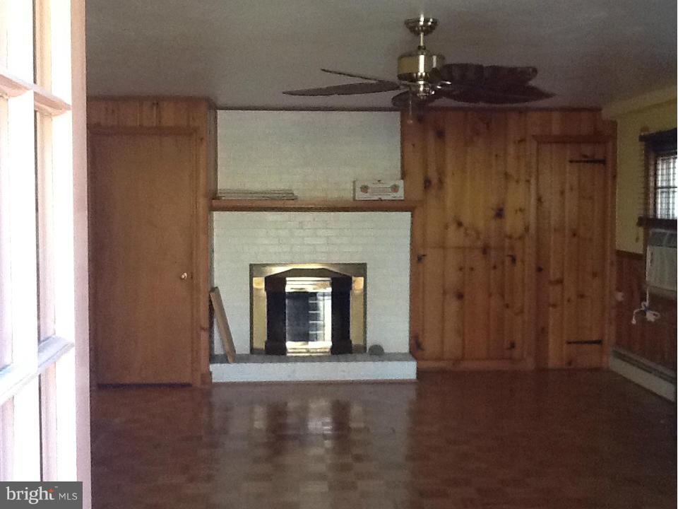 7103 Churchill Road McLean, VA 22101 - Photo 22 of 28 Lower Level Recreation Room with Fireplace