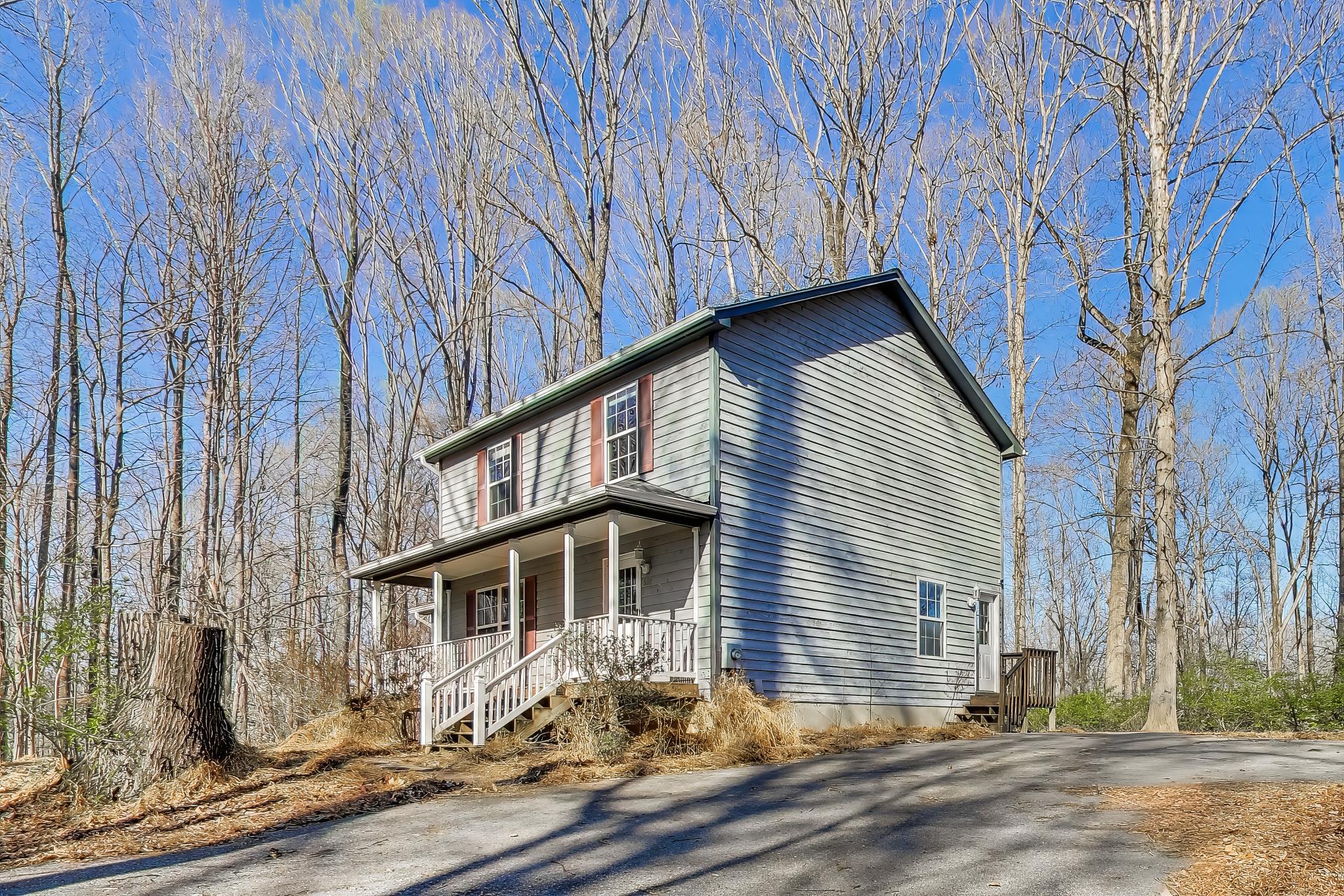 Charming home nestled on a private wooded lot.
