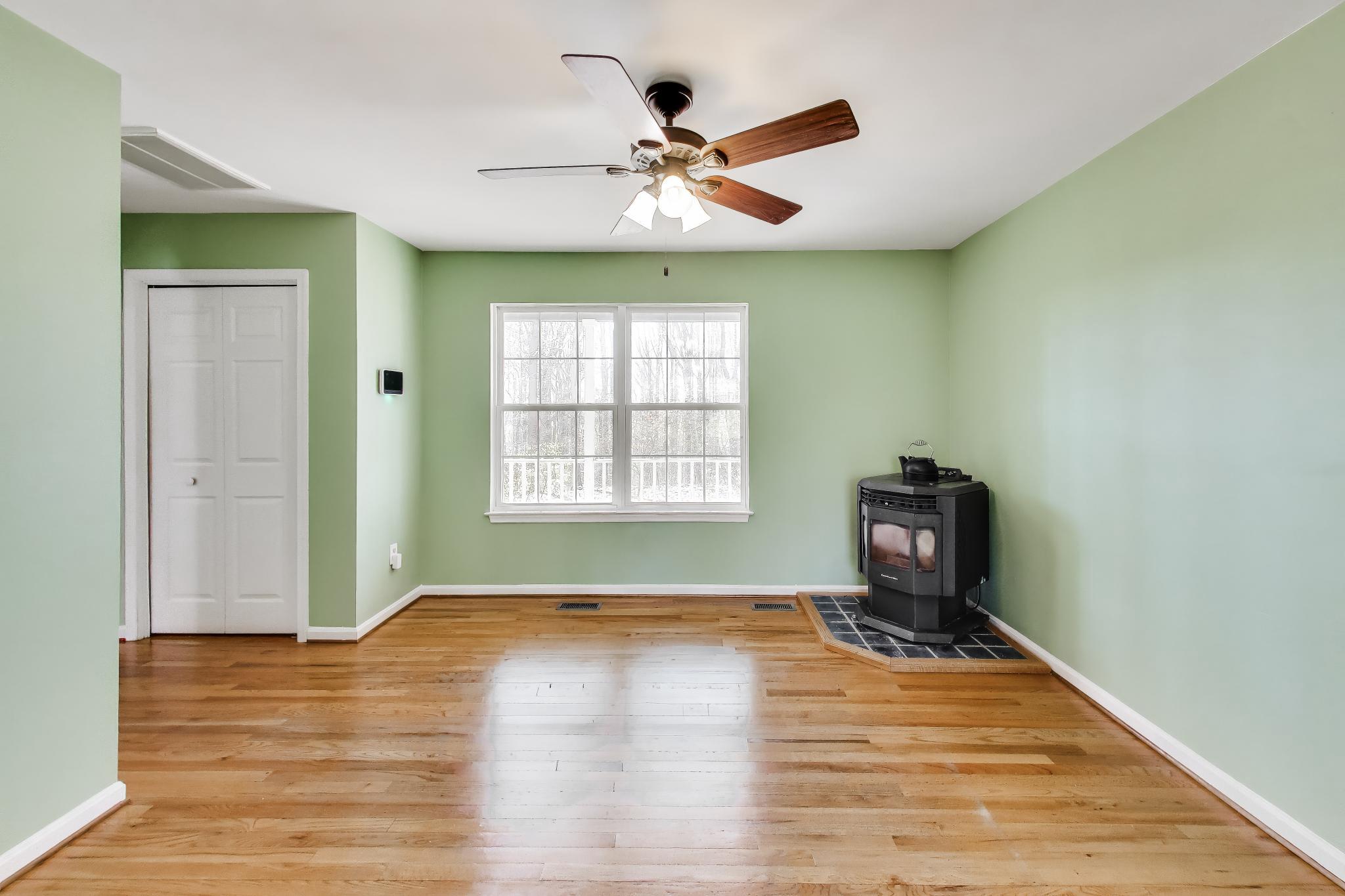 525 Stoakley Road Prince Frederick, MD 20678 - Photo 7 of 41 Living room with pellet stove.