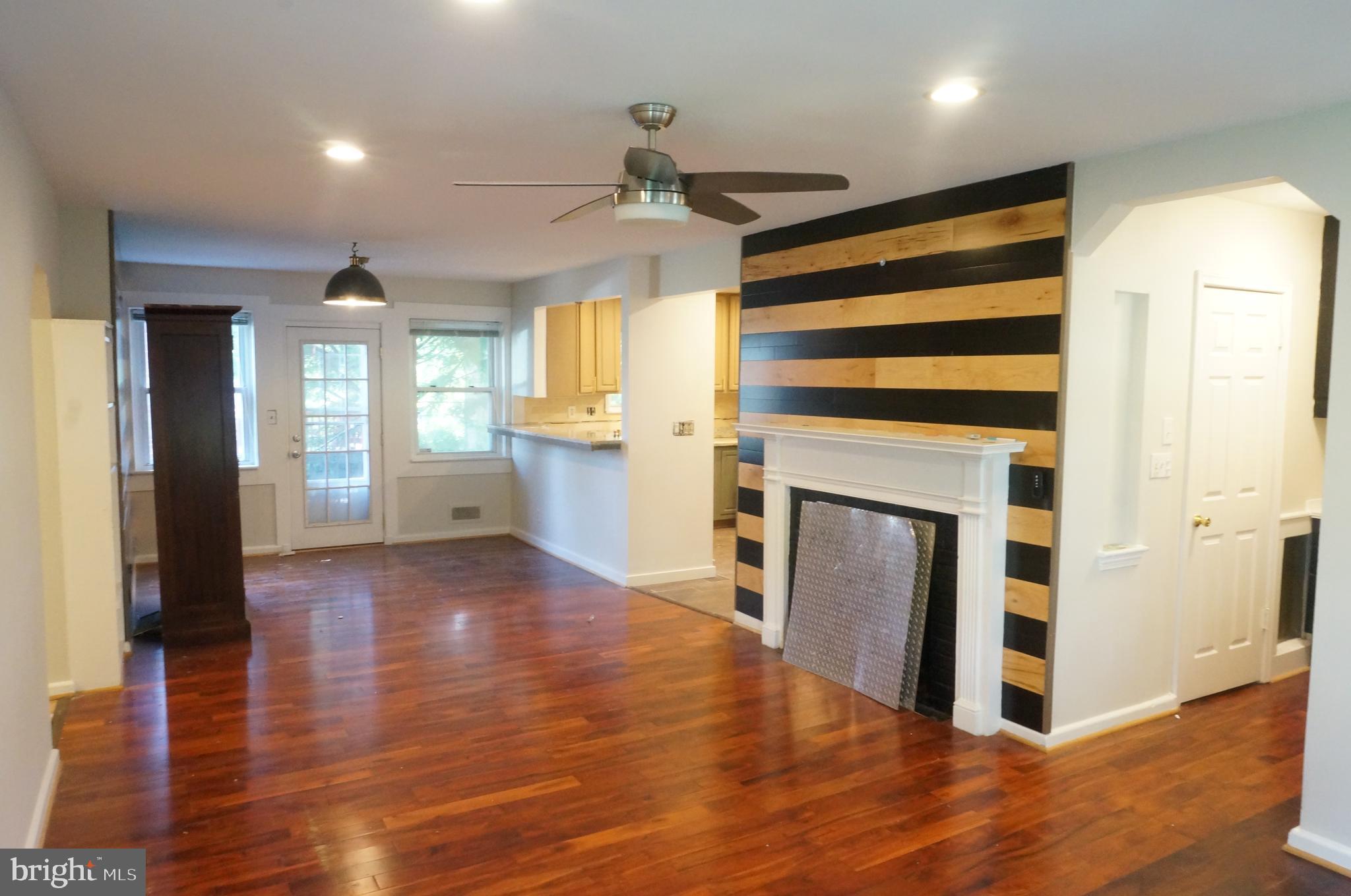 5603 Hawthorne Street Cheverly, MD 20785 - Photo 20 of 88 a view of a kitchen with wooden floor and a ceiling fan