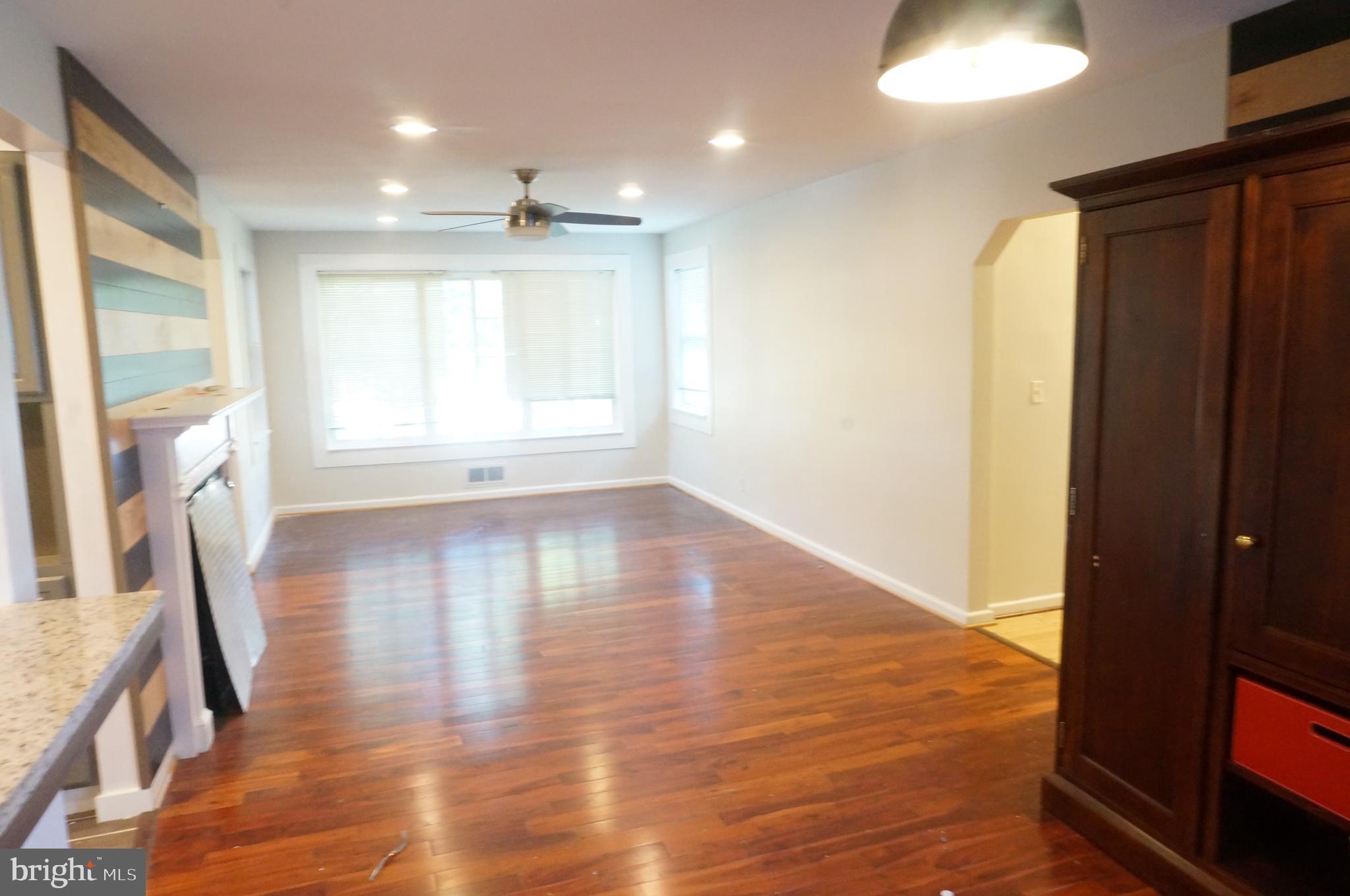 5603 Hawthorne Street Cheverly, MD 20785 - Photo 25 of 88 a view of empty room with wooden floor and fan