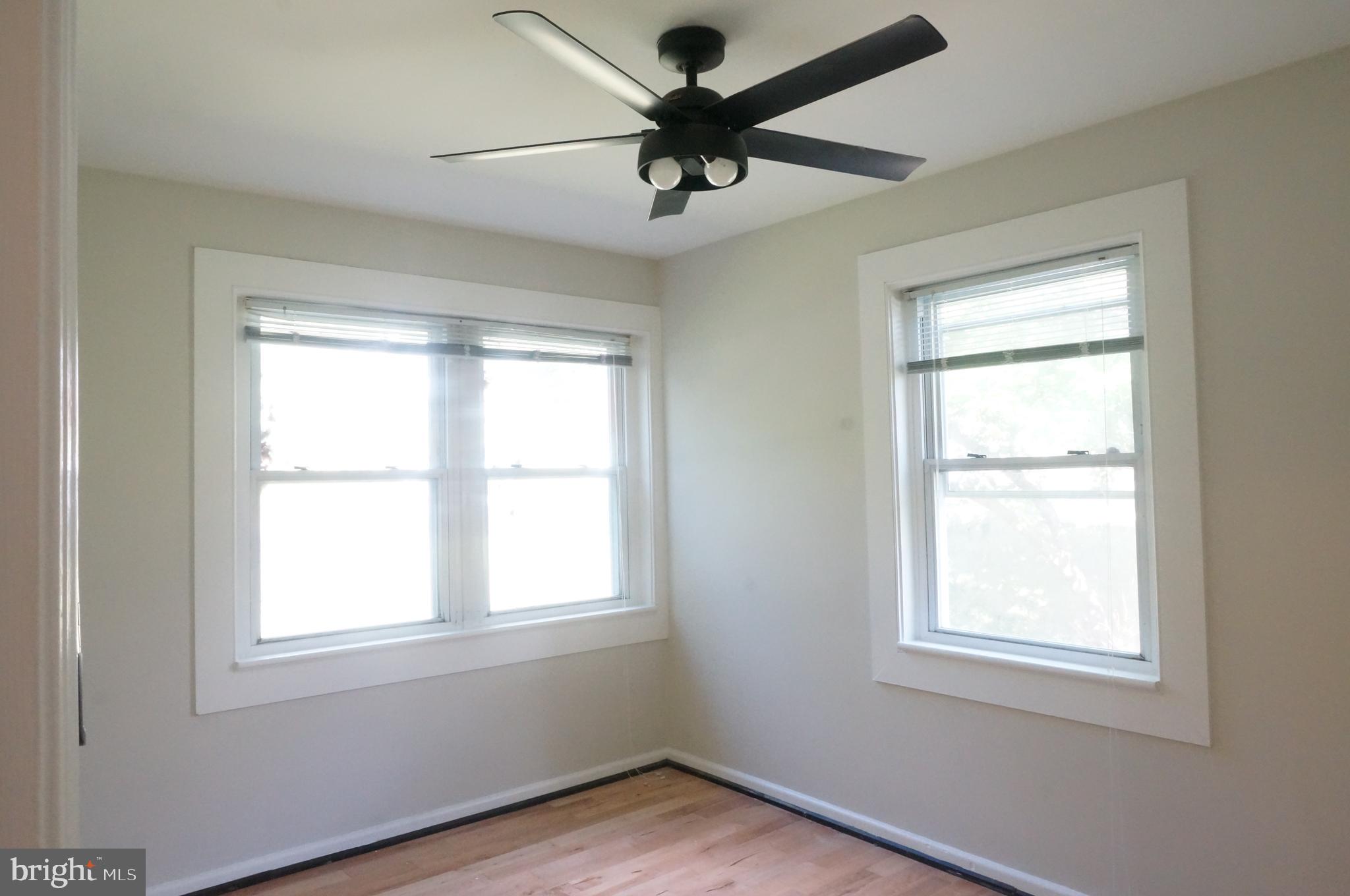 5603 Hawthorne Street Cheverly, MD 20785 - Photo 35 of 88 an empty room with a window and a fan