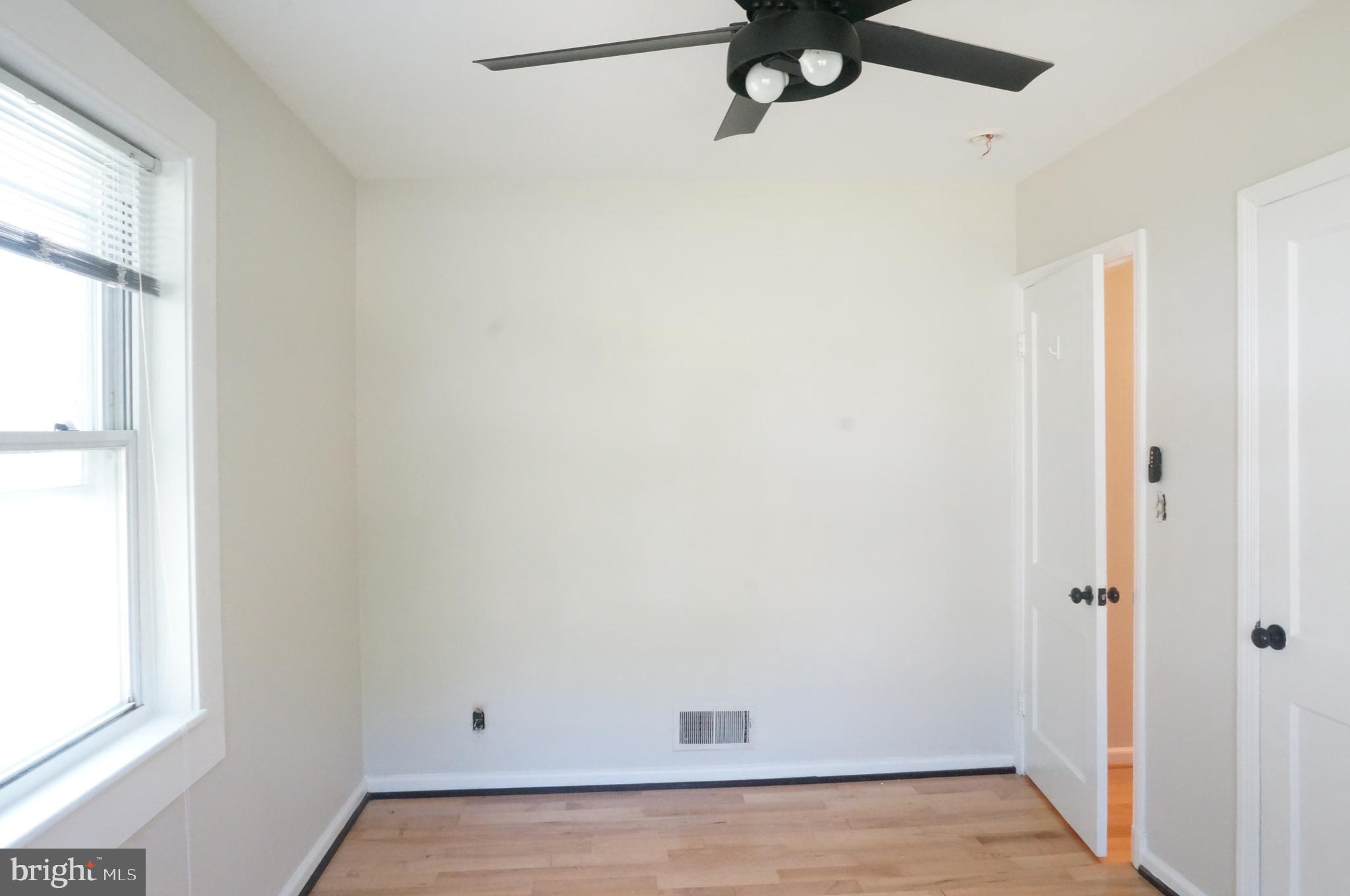 5603 Hawthorne Street Cheverly, MD 20785 - Photo 37 of 88 a view of a room with a window and a ceiling fan