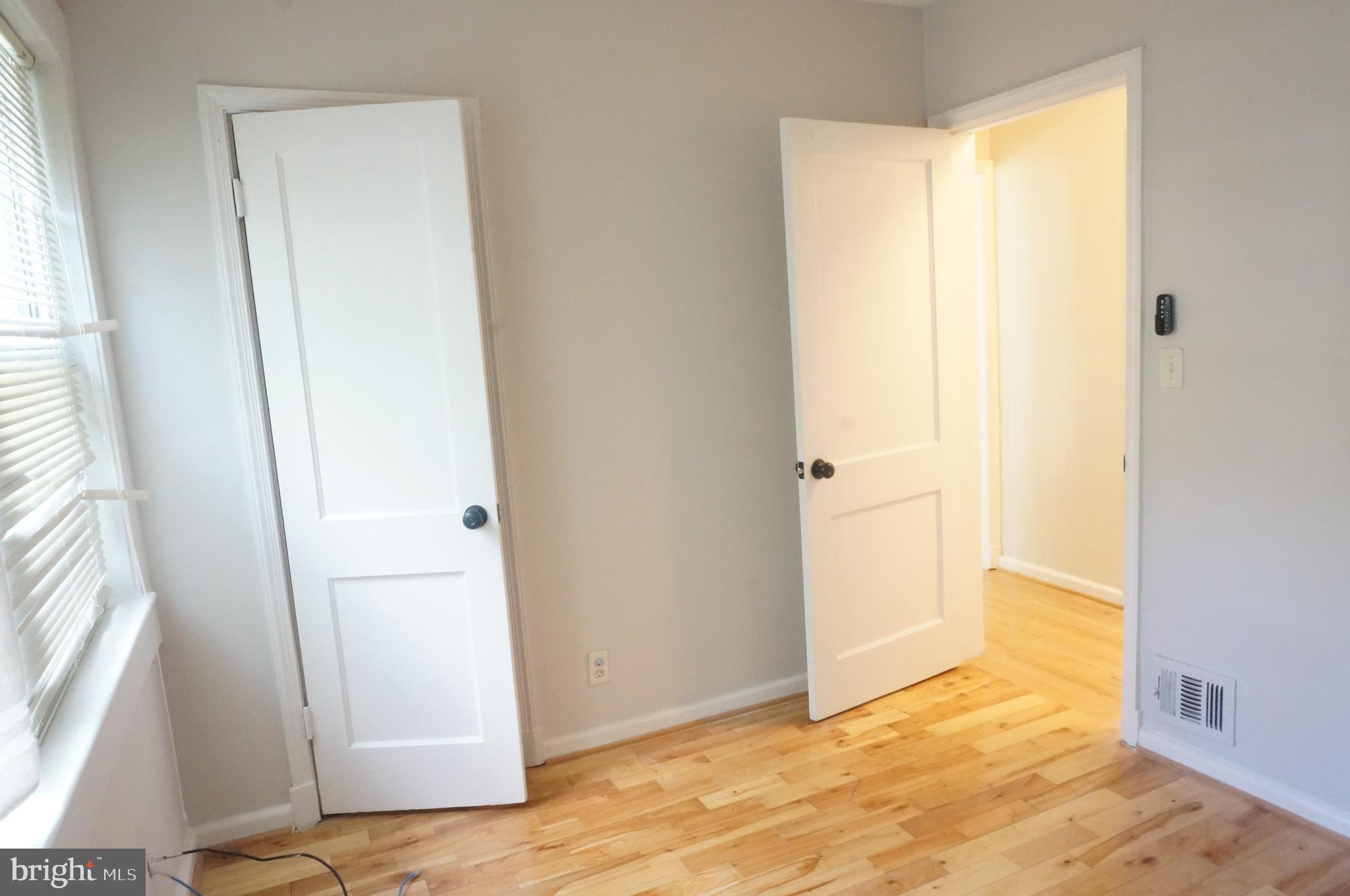 5603 Hawthorne Street Cheverly, MD 20785 - Photo 41 of 88 a view of an empty room with wooden floor and a window