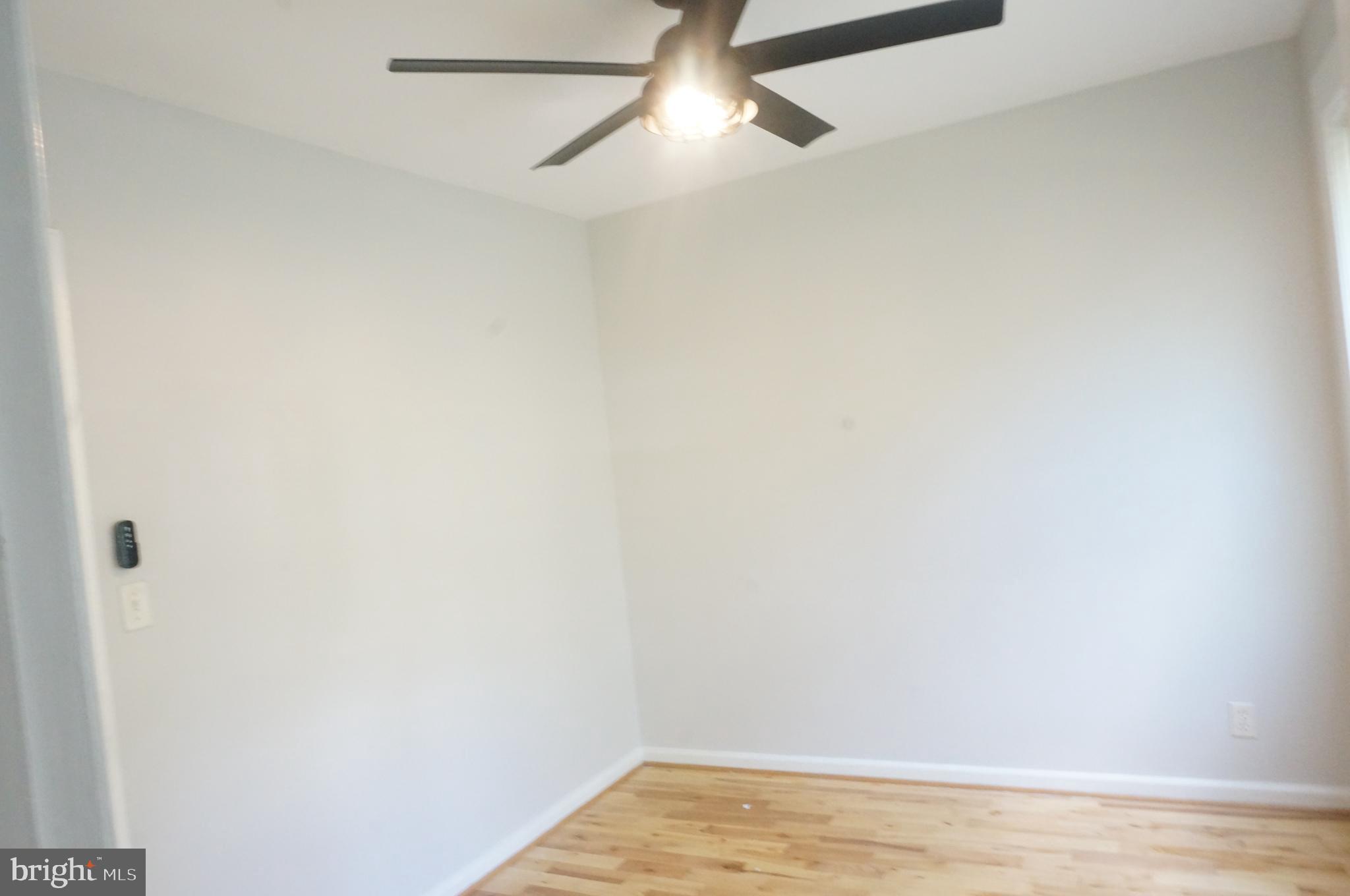 5603 Hawthorne Street Cheverly, MD 20785 - Photo 43 of 88 a view of empty room with wooden floor