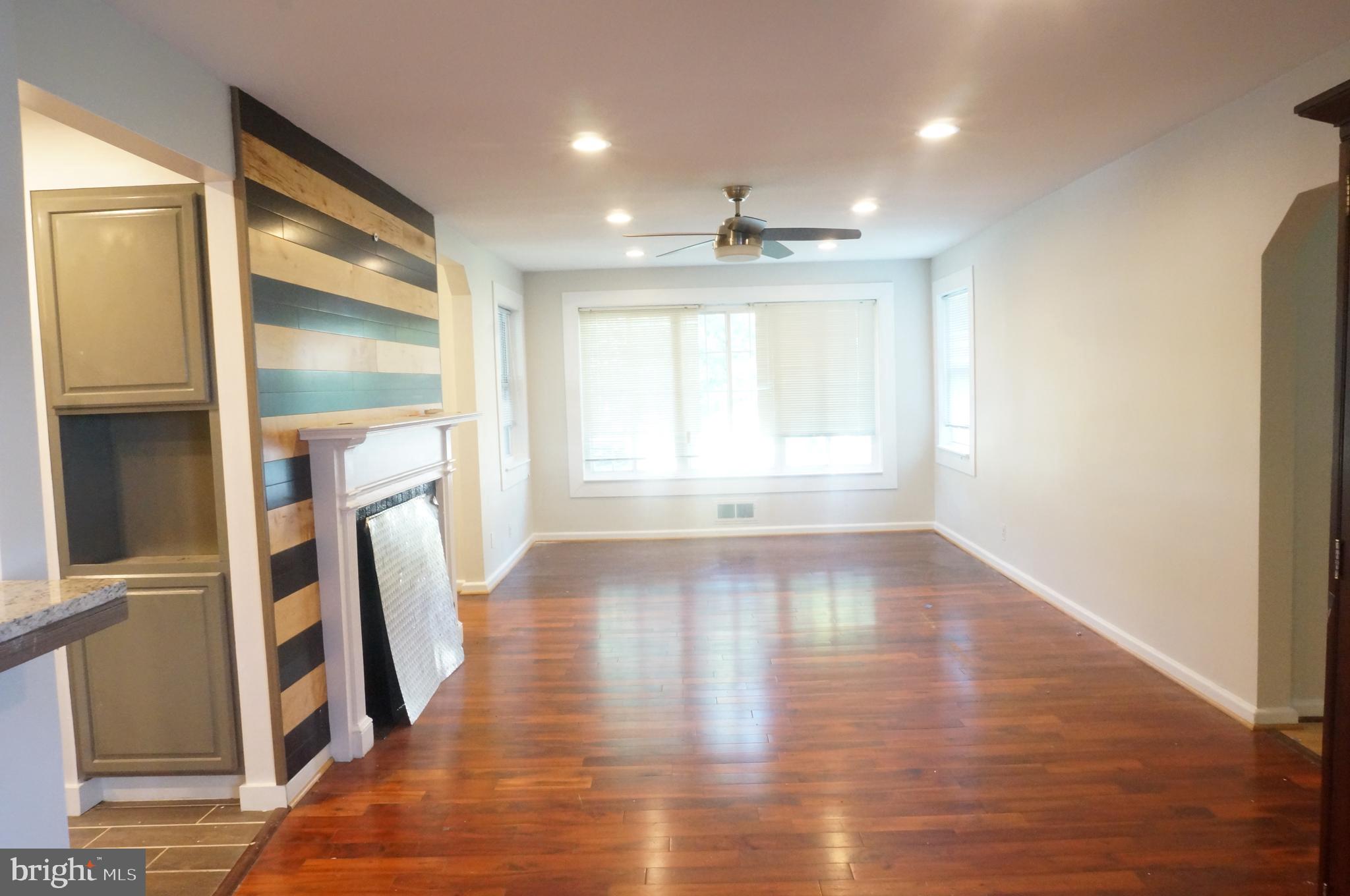 5603 Hawthorne Street Cheverly, MD 20785 - Photo 45 of 88 a view of empty room with wooden floor and fan