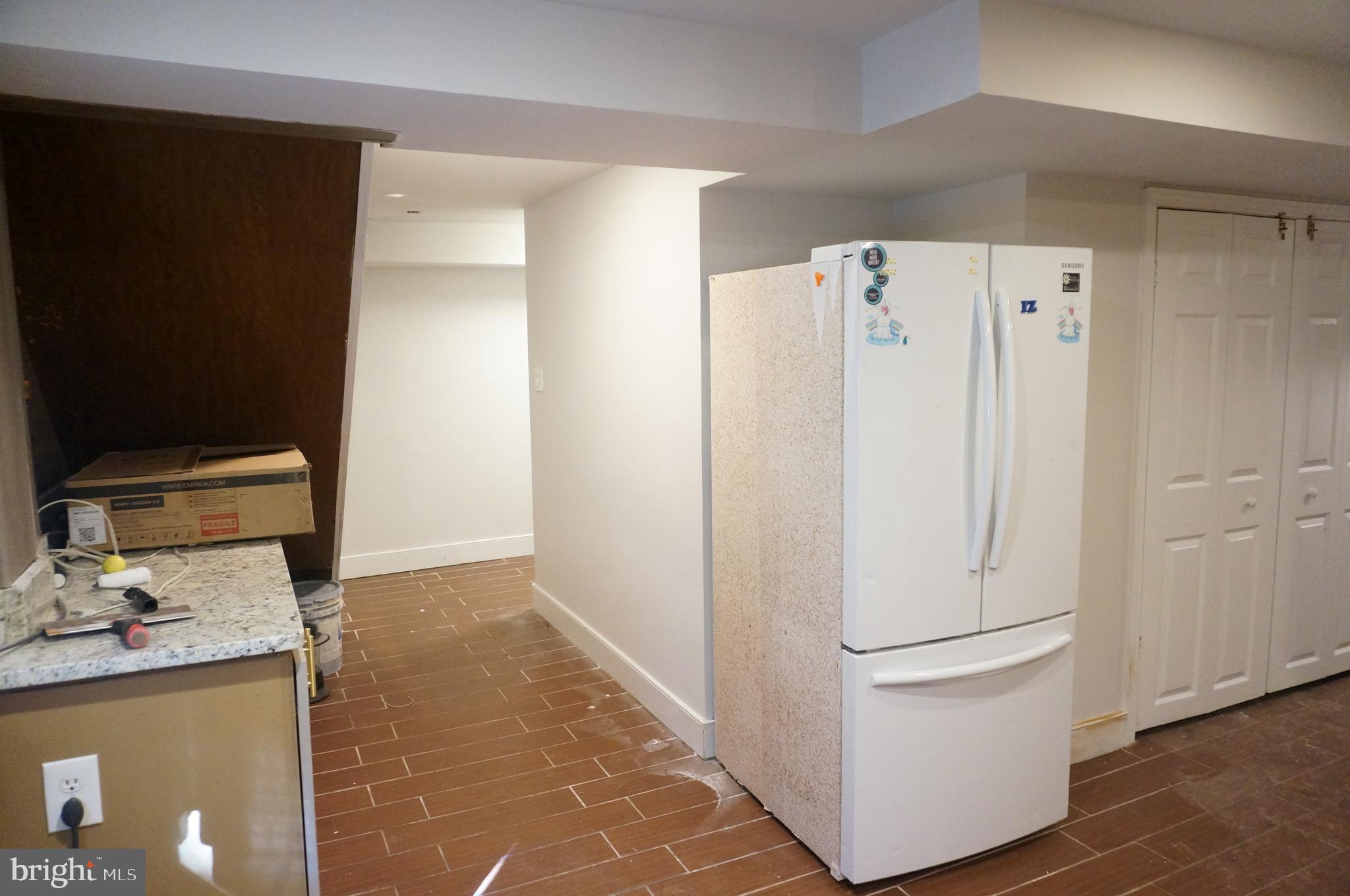 5603 Hawthorne Street Cheverly, MD 20785 - Photo 73 of 88 a white refrigerator freezer sitting inside of a kitchen