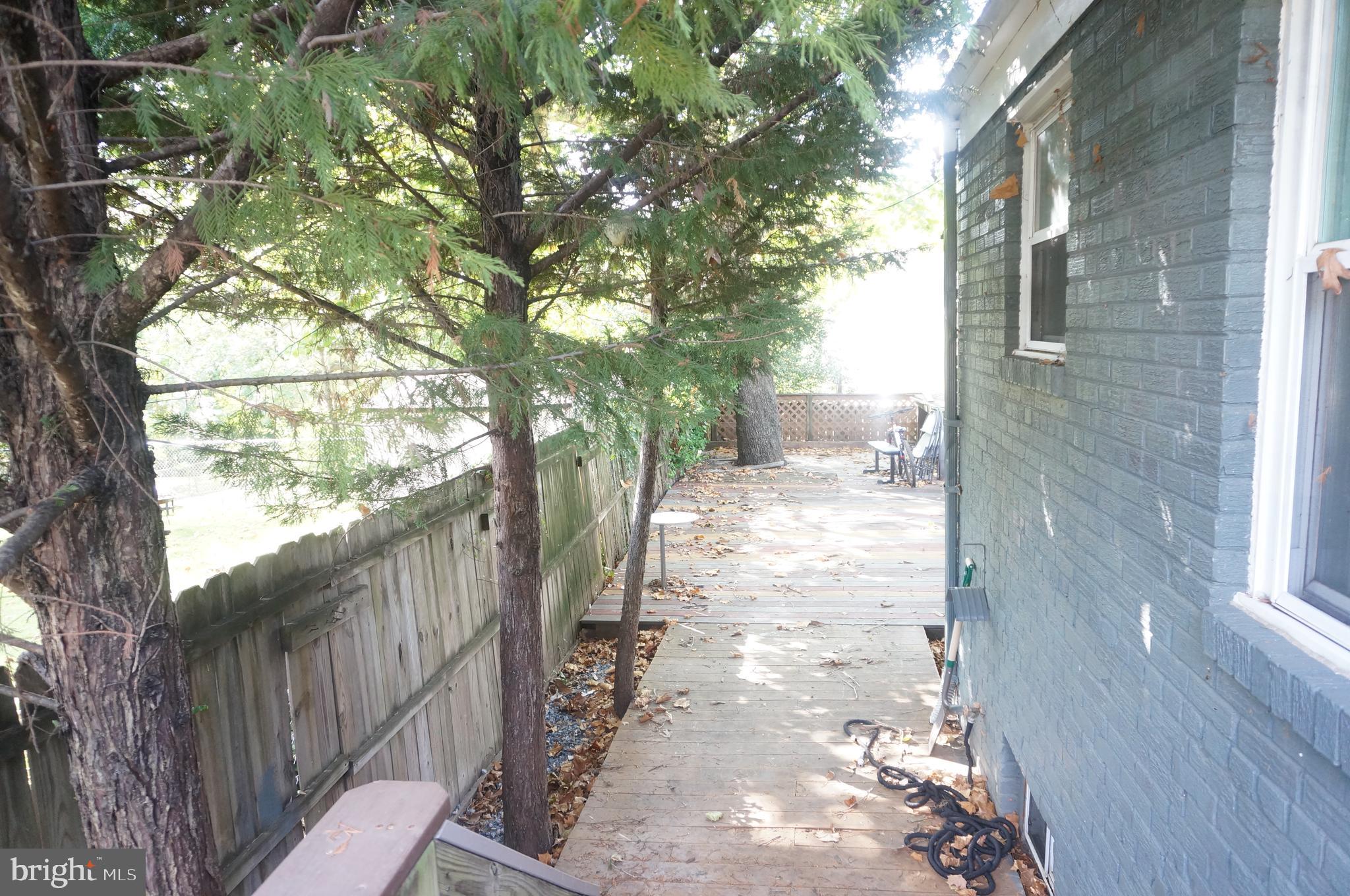 5603 Hawthorne Street Cheverly, MD 20785 - Photo 81 of 88 a view of a yard with wooden fence and a bench
