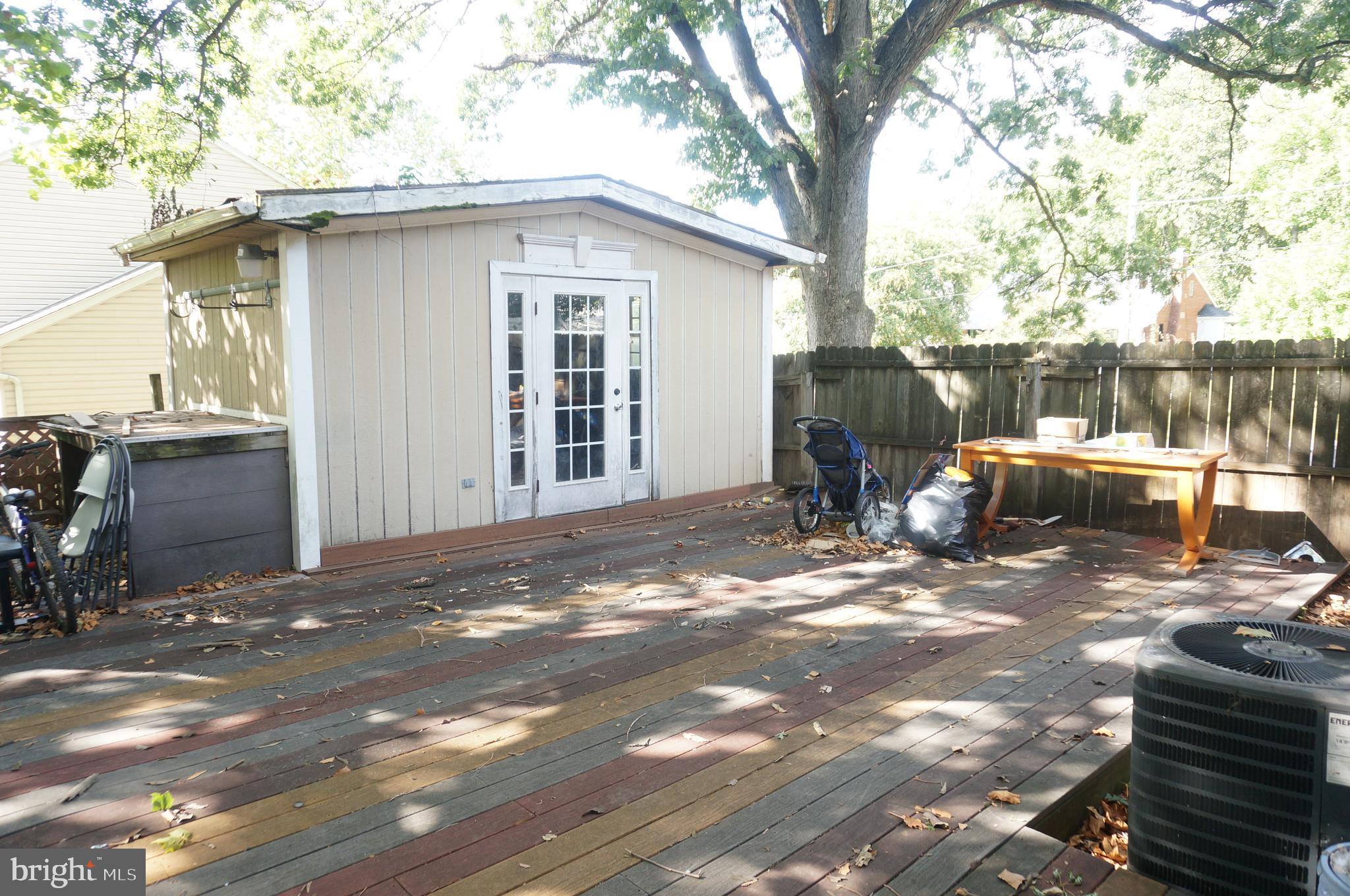 5603 Hawthorne Street Cheverly, MD 20785 - Photo 82 of 88 a backyard of a house with barbeque oven and outdoor seating