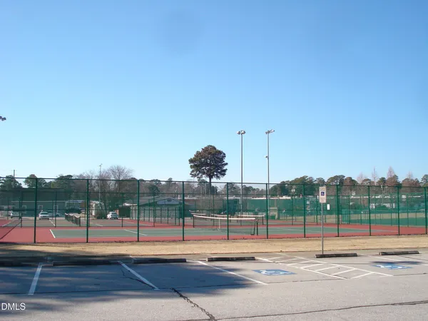 a view of outdoor space with a garden and signage