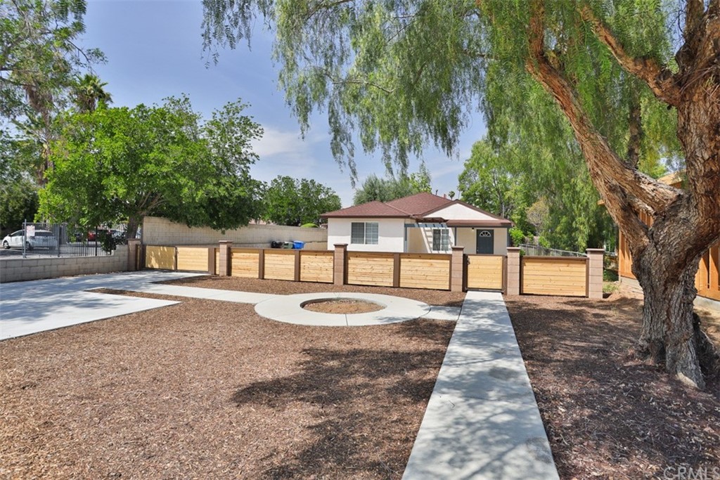 6631 School Cir Drive Riverside, CA 92506 - Photo 1 of 1 a front view of a house with yard and trees