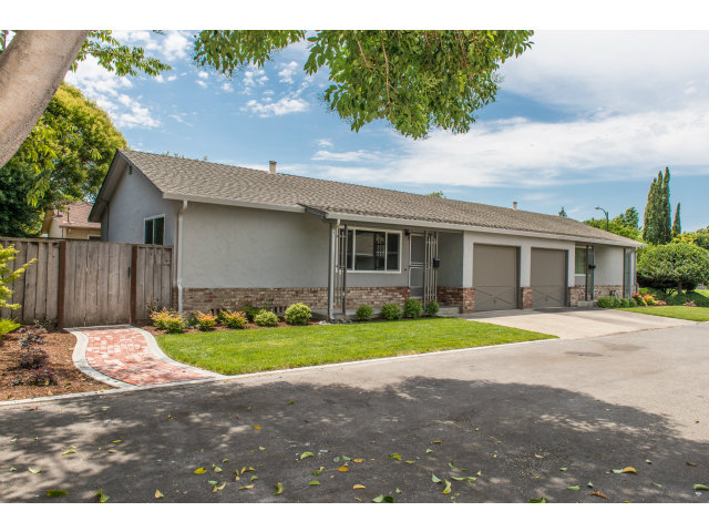 519 Piazza Drive Mountain View, CA 94043 - Photo 1 of 15 a front view of a house with a yard and garage