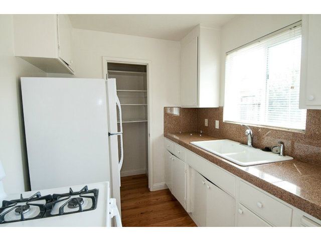 519 Piazza Drive Mountain View, CA 94043 - Photo 12 of 15 a kitchen with a refrigerator and a sink