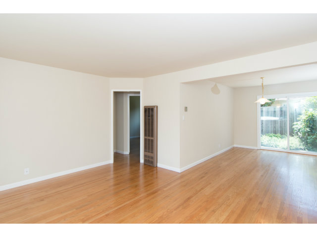 519 Piazza Drive Mountain View, CA 94043 - Photo 6 of 15 a view of an empty room with wooden floor and a window