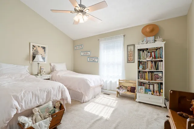 a bedroom with bed and a window