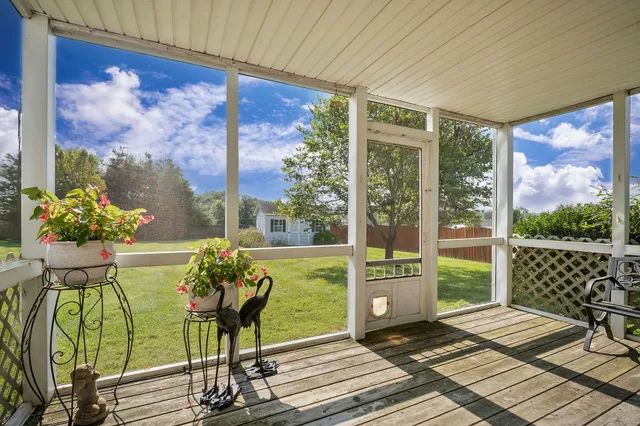 a balcony with furniture and windows