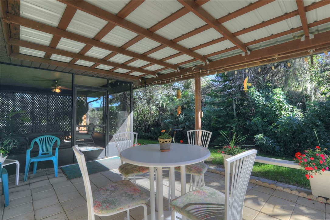 8205 Capewell Court Sebastian, FL 32958 - Photo 17 of 25 a view of a chairs and table in the patio