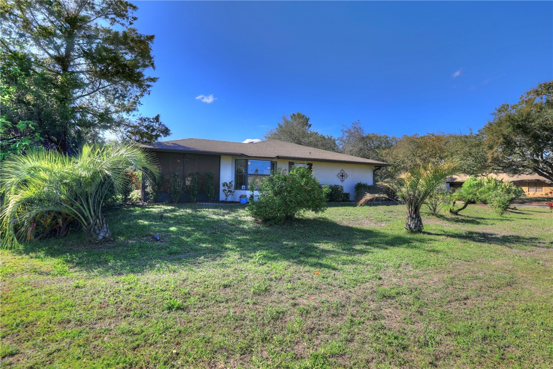 8205 Capewell Court Sebastian, FL 32958 - Photo 4 of 25 a front view of a house with a yard