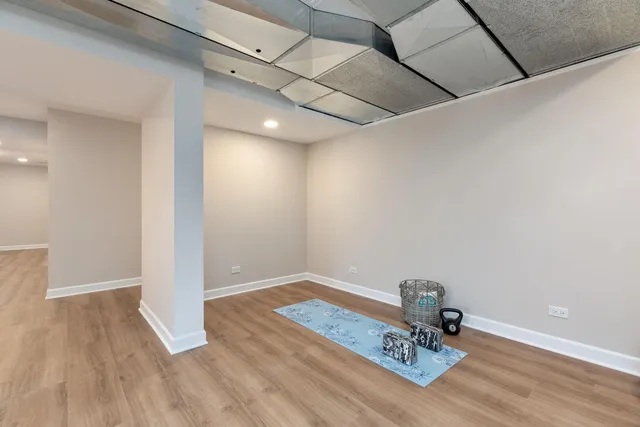 a view of a room with wooden floor