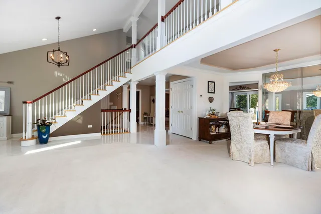 a view of a livingroom with furniture and stairs