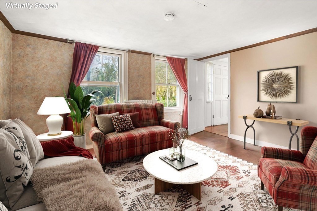 12 Spring Street Newton, MA 02464 - Photo 20 of 42 a living room with furniture and a large window