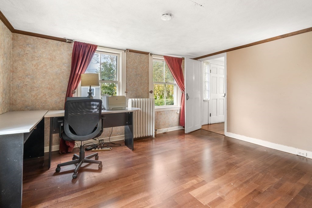 12 Spring Street Newton, MA 02464 - Photo 21 of 42 a view of a workspace with furniture and a window