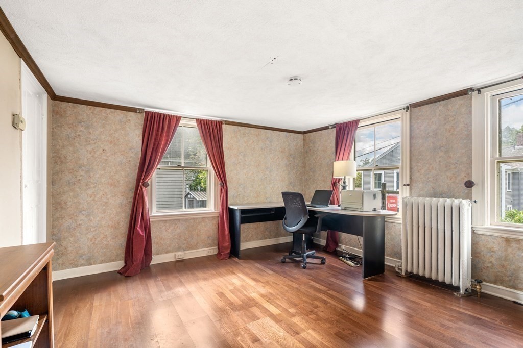 12 Spring Street Newton, MA 02464 - Photo 22 of 42 a view of a workspace with furniture and a window