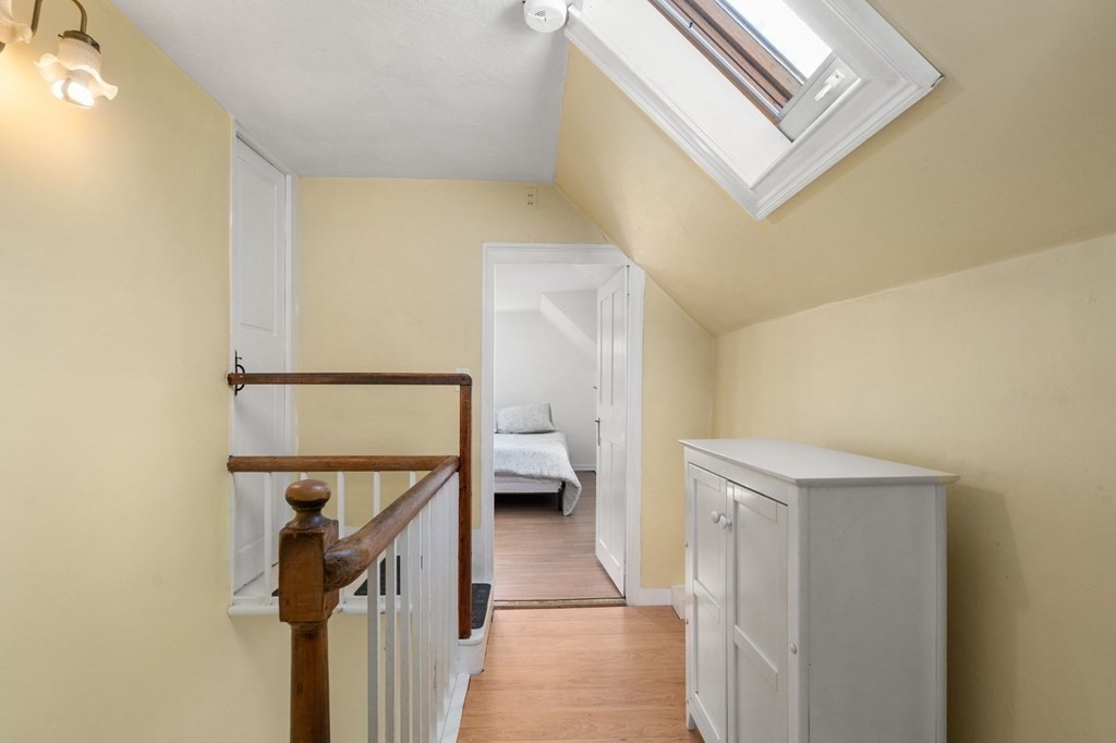 12 Spring Street Newton, MA 02464 - Photo 28 of 42 a view of a hallway with toilet