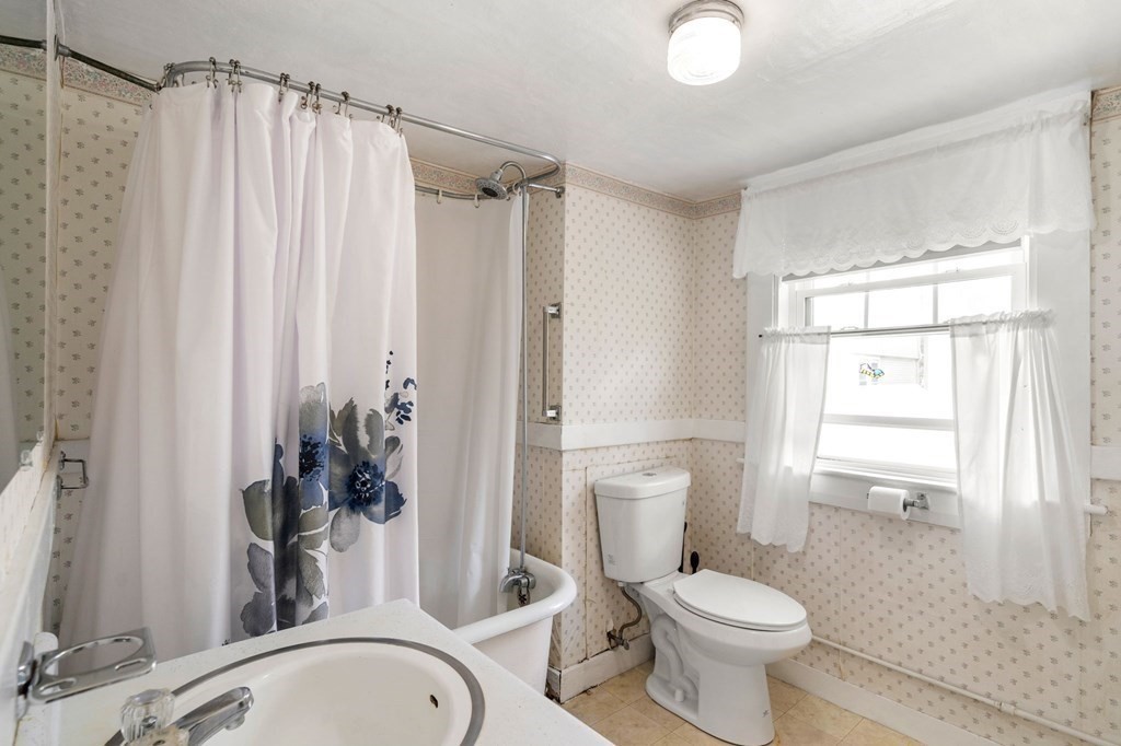 12 Spring Street Newton, MA 02464 - Photo 35 of 42 a bathroom with a sink toilet and shower