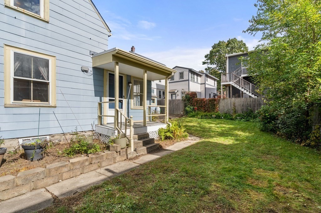 12 Spring Street Newton, MA 02464 - Photo 36 of 42 a front view of a house with garden