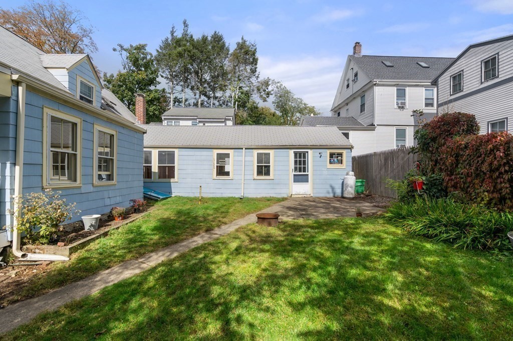 12 Spring Street Newton, MA 02464 - Photo 39 of 42 a front view of a house with a yard