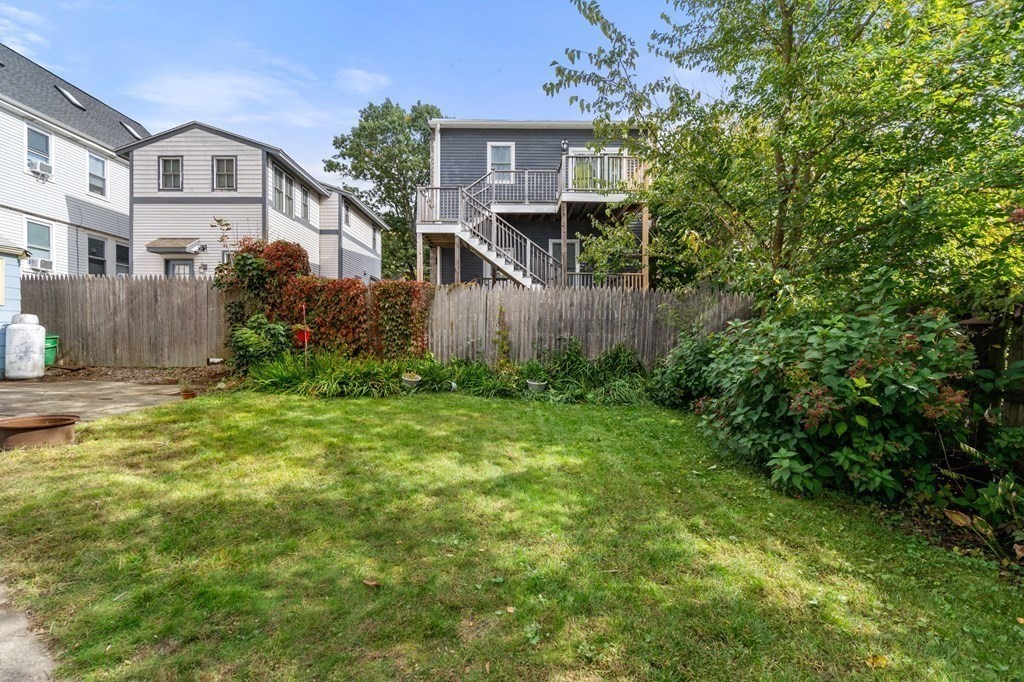 12 Spring Street Newton, MA 02464 - Photo 41 of 42 front view of house with a yard