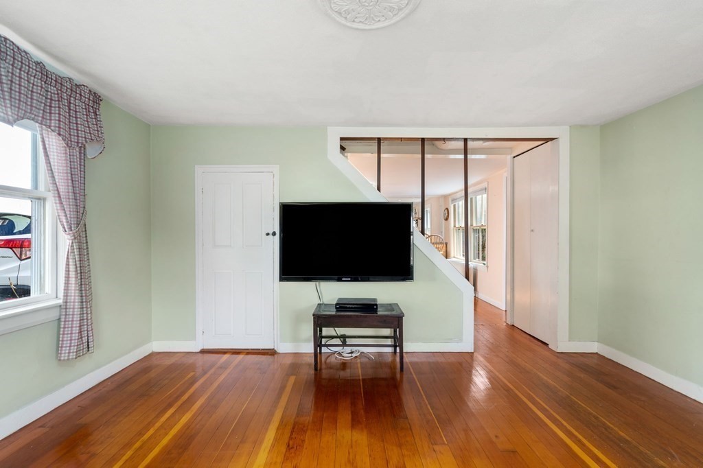 12 Spring Street Newton, MA 02464 - Photo 5 of 42 a living room with furniture and a flat screen tv