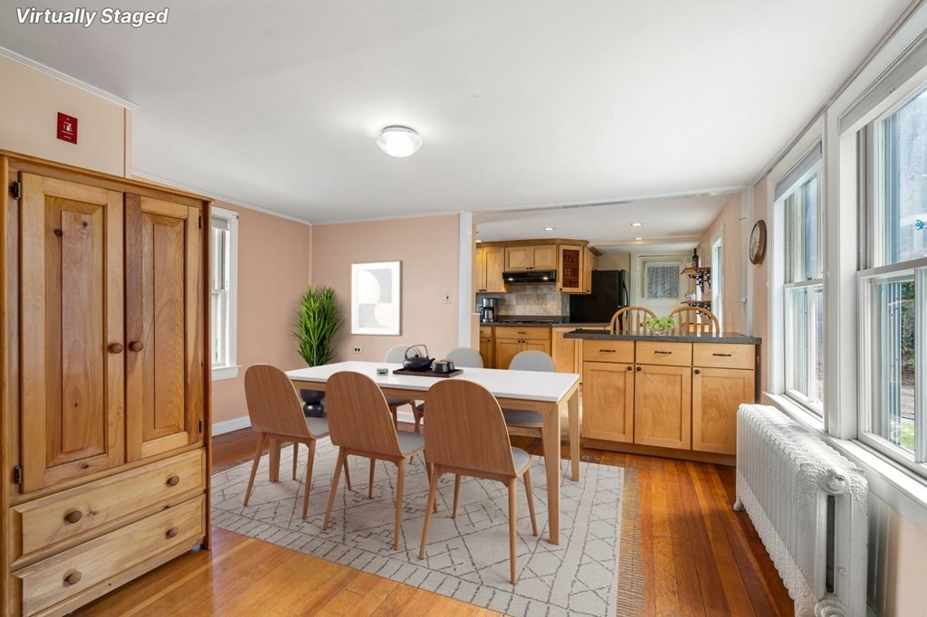 12 Spring Street Newton, MA 02464 - Photo 6 of 42 a view of a dining room with furniture window and wooden floor