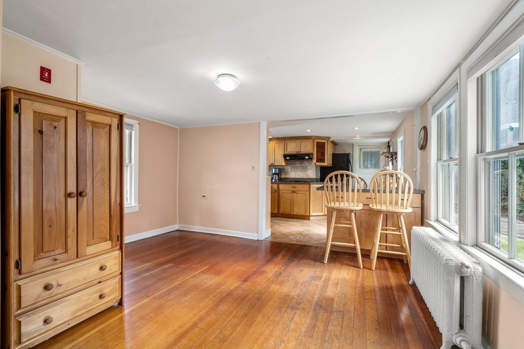 12 Spring Street Newton, MA 02464 - Photo 8 of 42 a view of a livingroom with wooden floor and furniture