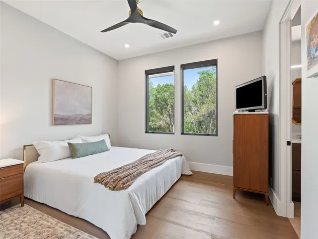 a view of a swimming pool with lounge chairs