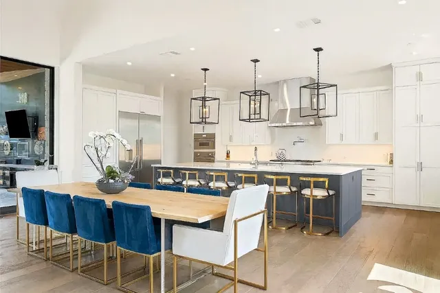 a view of a kitchen with a sink washer and dryer