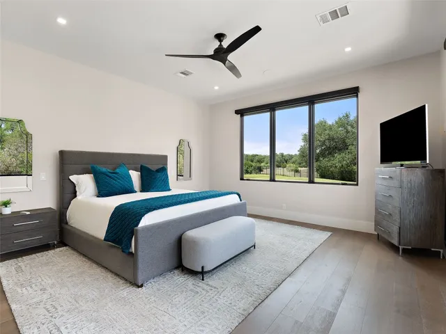 a kitchen with stainless steel appliances kitchen island granite countertop a refrigerator and a stove top oven